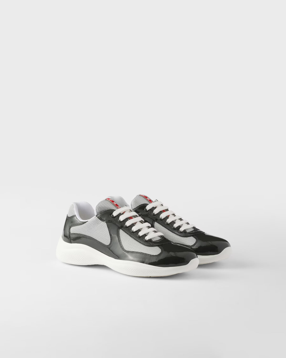 Sneakers Prada America’s Cup en cuir verni et tissu technique