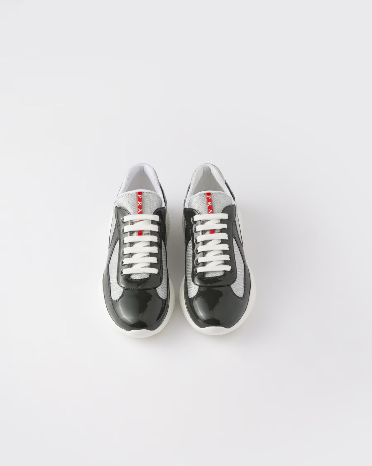 Sneakers Prada America’s Cup en cuir verni et tissu technique